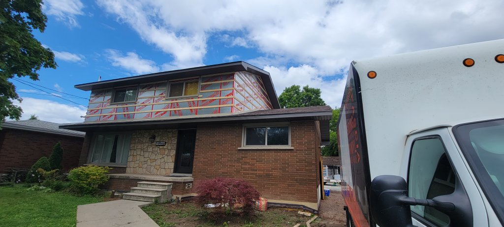 Siding and eavestrough before